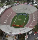  ?? Associated Press ?? NO ROSES
This Jan. 2, 2017, file pool photo, shows an aerial view of the empty Rose Bowl stadium before to the Rose Bowl game between USC and Penn State. California would not allow fans at the College Football Playoff semifinal on Jan. 1. As a result, the Rose Bowl was moved to Texas.