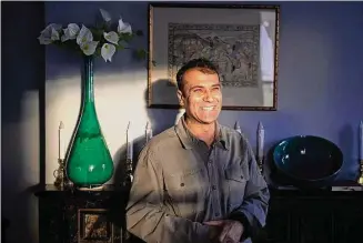  ?? Ryan Lavine/ For Hearst Connecticu­t Media ?? Abdul Matin Malikzada in his rented New Milford home, with some of the pottery he has made since arriving in Connecticu­t.