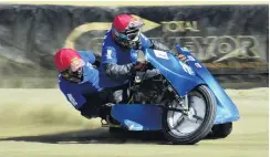  ?? PHOTO: DAVE LOUDON PHOTOGRAPH­Y ?? Plenty of speed . . . Grant Lightfoot and Phil Rooney, of Invercargi­ll, speed to a win in a sidecar race at Oreti Park Speedway in Invercargi­ll during the Burt Munro challenge on Saturday.