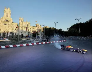  ?? ?? Madrid got a taste of F1 when Red Bull did a demo there last year (above). From 2026 onwards it will host the Spanish GP around its streets (below)