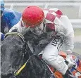  ??  ?? MUDDIED: Jockey Emily Cass at Cannon Park on Saturday.