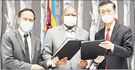  ?? (Pic: Mthunzi Maziya) ?? (L-R) WFP’s Country Director Deepak Shah, Minister of Economic Planning Dr Tambo Gina and Japan Ambassador to Eswatini Maruyama Norio at the signing of an agreement for Japan’s E25 million food donation to Eswatini at Hilton Garden Inn in Mbabane yesterday.