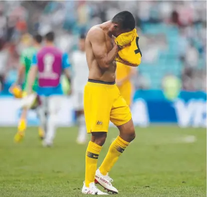  ?? SO LONG?: Australian forward Tim Cahill reacts after losing to Peru at the World Cup. ??
