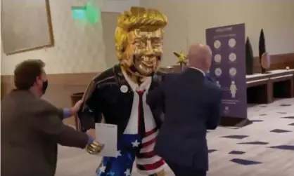  ?? Photograph: William Turton/Twitter ?? The Trump statue at CPAC. The statue is fitting because of the golden thread that runs through Trump’s career.
