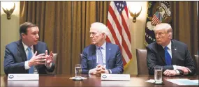  ?? Joshua Roberts / Bloomberg ?? Sen. Chris Murphy, D-Conn., from left, speaks as Senate Majority Whip John Cornyn, R-Texas, and President Donald Trump listen during a White House meeting with bipartisan members of Congress to discuss school and community safety last week.