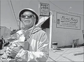  ?? Myung J. Chun Los Angeles Times ?? BUSY BEE Market in San Pedro is where Mike Watt gets his favorite sandwich: roast pork with mustard, onions and chili pepper. He's been going there since 1976.