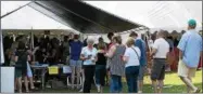  ?? PHOTOS COURTESY MADISON COUNTY HISTORICAL SOCIETY ?? Attendees line up to enter the Craft Beer Tent at the Madison County Hop Fest in 2017. This year’s 23rd annual Madison County Hop Fest weekend is Sept. 14-16, 2018.