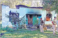  ?? ANI ?? Police stand guard near the area where the firing took place, at Mukroh, in West Jaintia Hills.