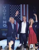  ?? BRENDAN SMIALOWSKI/AFP VIA GETTY IMAGES ?? President Joe Biden, California Gov. Gavin Newsom and first partner Jennifer Siebel Newsom at a rally in Long Beach on Monday.