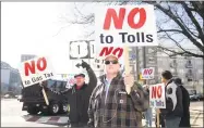  ?? Bob Luckey Jr. / Hearst Connecticu­t Media ?? Fritz Blau, center, the Stamford Republican Town chairman, holds a sign opposing tolls during a protest in Stamford in February against tolls and other measures.