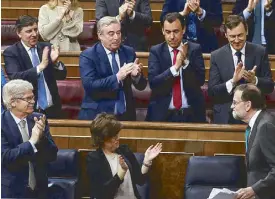  ?? REUTERS ?? Spanish Prime Minister Mariano Rajoy is applauded by party members during a motion of no-confidence debate at Parliament in Madrid on Thursday.