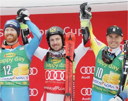  ??  ?? KRANJSKA GORA: Austria’s Marcel Hirscher, center, winner of an alpine ski, men’s World Cup giant slalom, celebrates on the podium with second-placed Norway’s Leif Kristian Haugen, left, and third-placed Sweden’s Matts Olsson, in Kranjska Gora,...