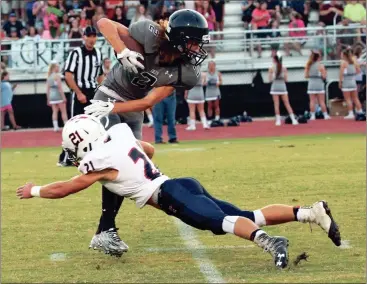  ??  ?? Heritage defensive back Austin Ferguson makes a hit on a Coahulla Creek receiver during a game last season. Ferguson and the Generals are hoping to dethrone Ridgeland atop the Region 6-AAAA standings this fall. (Catoosa County News file photo)