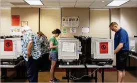  ?? REANN HUBER / REANN.HUBER@AJC.COM ?? Early voters cast their ballots at the Dunwoody Public Library on May 12. The primaries typically draw the most dedicated party voters.