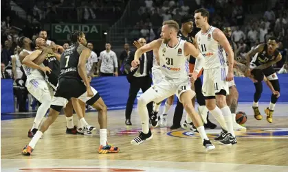  ?? Photograph: Anadolu Agency/Getty Images ?? A fight breaks out near the end of Thursday’s EuroLeague playoff game between Real Madrid and Partizan at Wizink Center in Madrid, Spain.
