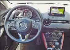  ?? — BRIAN HARPER/DRIVING ?? Mazda’s CX-3 is roomy up front.