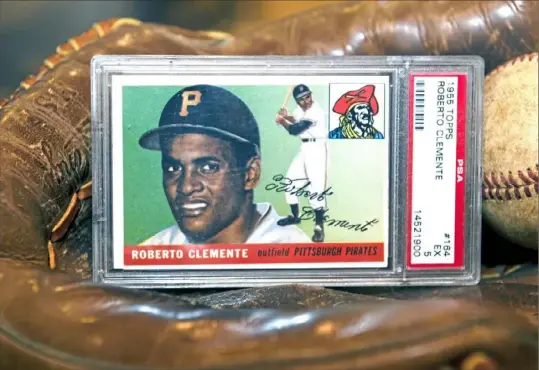  ?? Pittsburgh Post-Gazette ?? The Roberto Clemente Museum in Lawrencevi­lle has one of his 1955 Topps rookie cards on display.