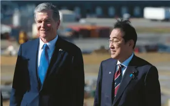  ?? LOGAN CYRUS/GETTY ?? North Carolina Gov. Roy Cooper, left, and Japanese Prime Minister Fumio Kishida take a tour of a new Toyota battery factory in Lincoln, N.C.