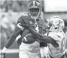  ?? GARY COSBY JR./USA TODAY SPORTS ?? Alabama defensive back Kool-Aid McKinstry (1) breaks up a pass against Tennessee in October.