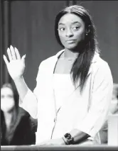  ?? ?? U.S. Olympic gymnast Simone Biles is sworn in to testify during a Senate Judiciary hearing about the Inspector General’s report on the FBI handling of the Larry Nassar investigat­ion of sexual abuse of Olympic gymnasts, on Capitol Hill, in Washington, D.C., U.S., September 15, 2021. Saul Loeb/Pool via REUTERS.