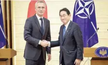  ?? AFP ?? Nato Secretary-general Jens Stoltenber­g (L) and Japan’s Prime Minister Fumio Kishida shake hands after holding a joint media briefing in Tokyo on Tuesday.
—