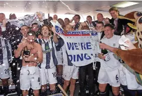  ?? ?? The players celebrate in the dressing room (David Davies/pa)