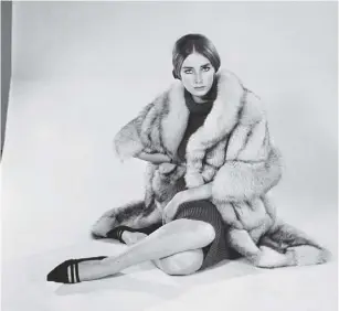  ??  ?? 2 Tania Mallet modelling a fur coat in 1964, when she was earning the equivalent of £20,000 aweekin today’s money