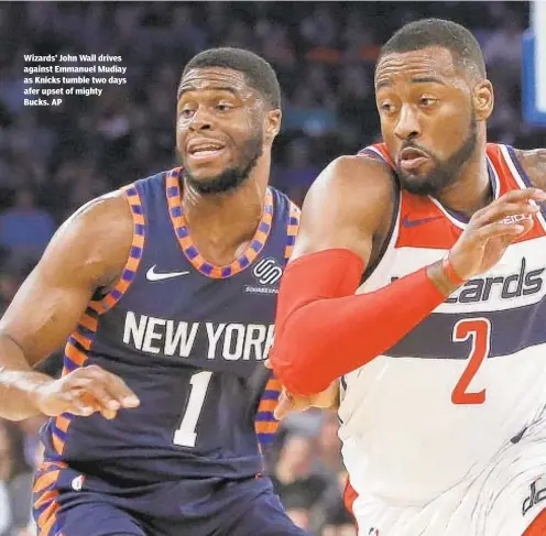  ?? AP ?? Wizards’ John Wall drives against Emmanuel Mudiay as Knicks tumble two days afer upset of mighty Bucks.
