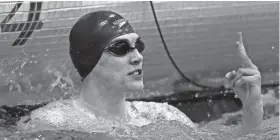  ?? USA TODAY NETWORK / WISCONSIN ?? Brookfield’s Michael Linnihan puts up two fingers after winning the 100-yard freestyle, his second first-place finish at the WIAA Division 1 state swimming and diving meet on Saturday in Madison.