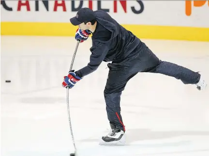  ?? JOHN MAHONEY/MONTREAL GAZETTE ?? Habs goalie Carey Price takes a shot prior to optional practice at the team’s training facility in Brossard on Wednesday. Price didn’t bring along his goalie equipment, preferring to skate and practise shooting in sweats.