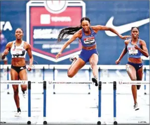  ?? JAMIE SQUIRE/GETTY IMAGES/AFP ?? Dalilah Muhammad clears the last hurdle on her way towards winning the women’s 400m hurdles and setting a new world record during the 2019 USATF Outdoor Championsh­ips at Drake Stadium on Saturday in Des Moines, Iowa.