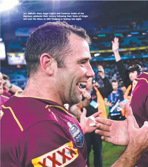  ??  ?? ALL SMILES: Dane Gagai ( right) and Cameron Smith of the Maroons celebrate their victory following their State of Origin win over the Blues at ANZ Stadium in Sydney last night.