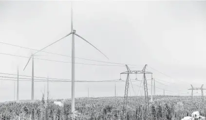  ?? Mikael Sjoberg / Bloomberg ?? Electrical power lines hang from transmissi­on pylons at the Markbygden ETT wind park project near Pitea, Sweden.