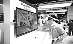  ??  ?? An attendee plays the Huawei VR2 virtual reality music game on the last day of CES 2019 at the Las Vegas Convention Centre in Las Vegas, Nevada. — AFP photo