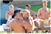  ??  ?? Anton and Belle kiss in Love Island’s Raunchy Races challenge