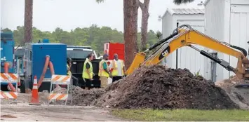  ?? CARLINE JEAN/SOUTH FLORIDA SUN SENTINEL ?? Fort Lauderdale Fire Rescue on the scene of a water main break along the 2500 block of Northwest 55th Court, near the Fort Lauderdale Executive Airport in 2019.
