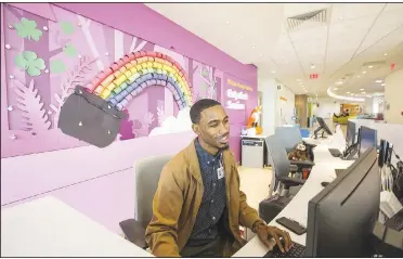  ?? NWA Democrat-Gazette/BEN GOFF • @NWABENGOFF ?? Devin Harris, patient access representa­tive, works the reception desk March 8 in the outpatient services area at Arkansas Children’s Northwest in Springdale.