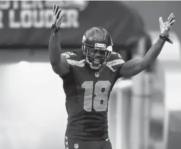  ?? JONATHAN FERREY/GETTY IMAGES ?? Wide receiver Sidney Rice of the Seattle Seahawks tries to stir up the crowd prior to a game against the San Francisco 49ers. But apparently the NFL doesn’t like the passion to include on-field profanitie­s.