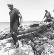  ?? CONTRIBUTE­D ?? Jae Edwards (left) and teammate Dwayne Fields of Sprytraini­ng taking their kayak to sea. They are kayaking around Jamaica to bring awareness to the impact of non-communicab­le diseases.