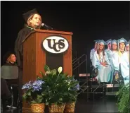  ?? COURTESY UCS ?? Former Utica Community Schools Board of Education president Gene Klida addresses students graduating from the Utica Academy of Internatio­nal Studies.