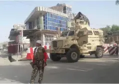  ??  ?? AN AFGHAN security force personnel stands guard yesterday at the entrance gate of the government compound of Farah province, in western Afghanista­n.