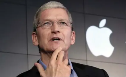  ?? RICHARD DREW/THE ASSOCIATED PRESS ?? Led by CEO Tim Cook, Apple faces competitio­n in new product areas including music streaming, wearable computers and mobile payments.