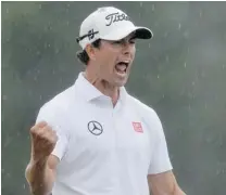  ?? JEWEL SAMAD/ GETTY IMAGES ?? Adam Scott reacts after sinking a birdie putt on the second playoff hole Sunday to beat Angel Cabrera and win the Masters.
