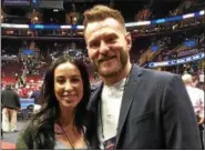  ?? MARK PODOLSKI — THE NEWS-HERALD ?? Ryan and Stipe Miocic at the NCAA Division I Wrestling Championsh­ips at Quicken Loans Arena last March. Ryan Miocic is expecting the couple’s first child in August.