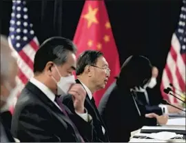  ?? Frederic J. Brown Associated Press ?? CHINESE foreign policy official Yang Jiechi, center, rebutted charges of human rights abuses in what the U.S. secretary of State called a “defensive response.”