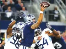  ?? AP PHOTO/MICHAEL AINSWORTH ?? Dallas Cowboys quarterbac­k Dak Prescott works under pressure in the pocket against the Tennessee Titans during Monday’s game in Arlington, Texas.