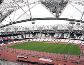  ?? AP ?? Workers continue setup preparatio­ns ahead of the start of the IAAF World Athletics Championsh­ips at the London Stadium on Tuesday. The meet begins tomorrow.