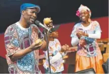  ??  ?? From left, Tafadzwa Muchinerip­i, his son Chamunorwa, 10, and wife Mandy perform with their Chihera group Sunday in the Sharp Auditorium at the Denver Art Museum.