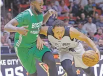  ?? THE ASSOCIATED PRESS ?? Spurs guard Bryn Forbes, right, drives against the Celtics’ Jaylen Brown on Wednesday in Salt Lake City.