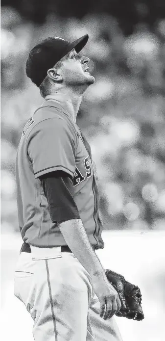  ?? Brett Coomer / Staff photograph­er ?? Jake Odorizzi came in on short notice and threw four innings in Game 2. After the abrupt call to the bullpen, Odorizzi had to shorten his warmup routine from 30 minutes to 14.